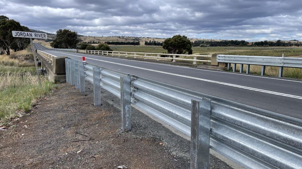 The RamShield Transition by Safe Direction, a MASH Test Level 3 compliant guardrail transition system, with thrie-beam guardrail supported by HC posts designed for steel to rigid barriers connection.